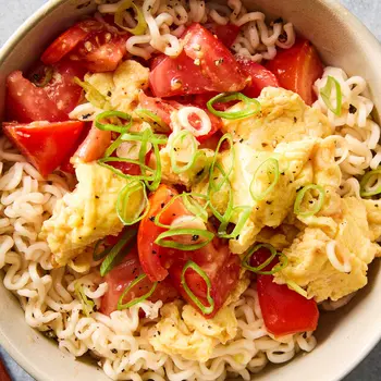 Hetty Lui McKinnon’s tomato and egg noodles uses uncooked tomatoes for a pop of acidity.